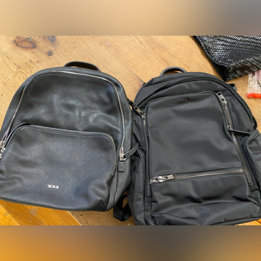 Tumi Hudson leather backpack on left for sale.